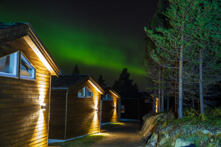 Bjørnfjell Mountain Lodge under the Northern Lights. Photo: Danil Røkke
